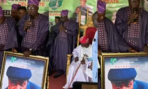 TAMPAN gifts Baba Agbako a frame