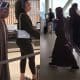 Olusegun Obasanjo carries his bag at the airport